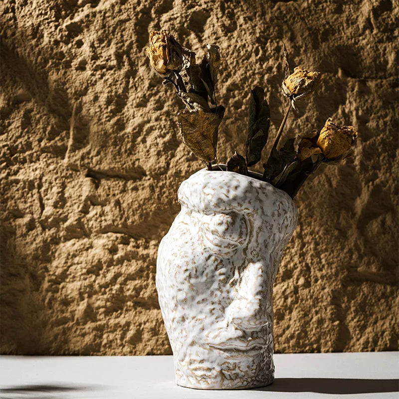 Elevate your home decor with our Creative Abstract White Face Vase, a modern ceramic piece perfect for fresh flowers and pampas grass.