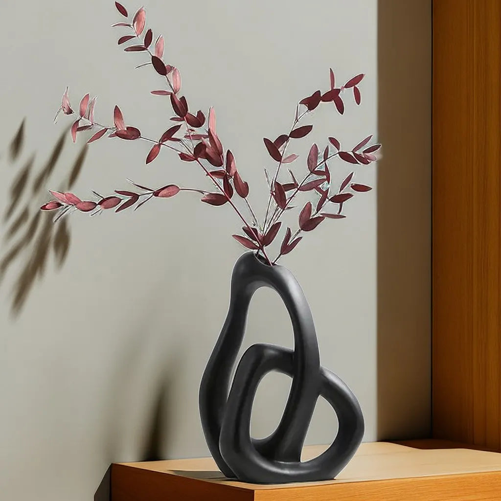 Elevate your decor with our Nordic Abstract Ceramic Vase, perfect for dried flowers or as a stunning accent piece in any room.