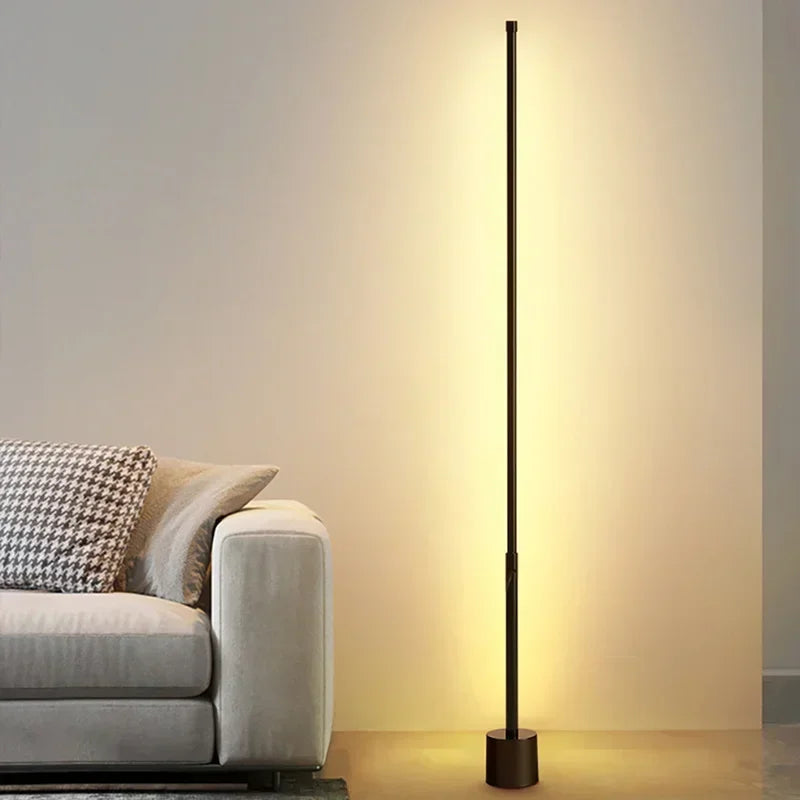 Illuminate your space with our Modern LED Floor Lamp, designed for stylish ambient lighting in any room, offering a sleek black finish and warm glow.