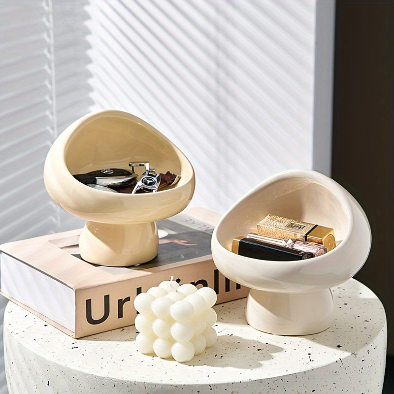 Discover the 1pc Ceramic Mushroom Cream Wind Earrings and Key Storage Ornament, perfect for organizing cosmetics and valuables in any space.
