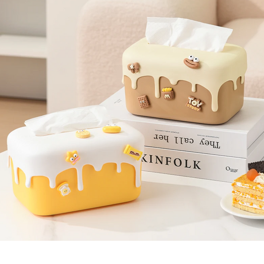 Elevate your home decor with our Cream Cake Tissue Box, a chic and creative storage solution perfect for any living room.