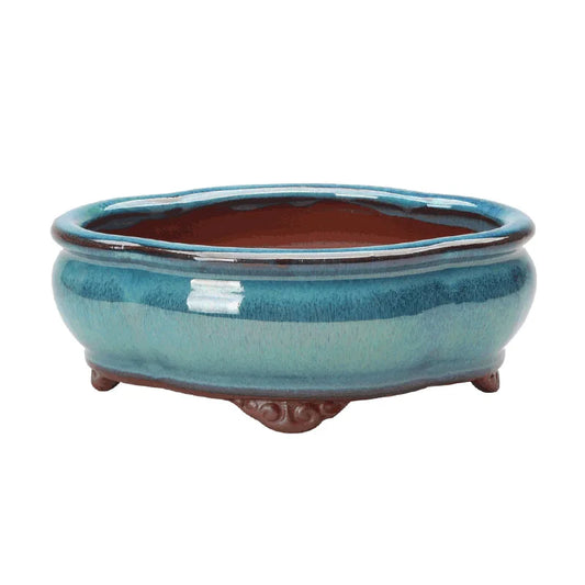 Enhance your space with the Creative Chinese Style Bonsai Flowerpot, a ventilated, elegant purple sands ceramic planter perfect for home or office greenery.