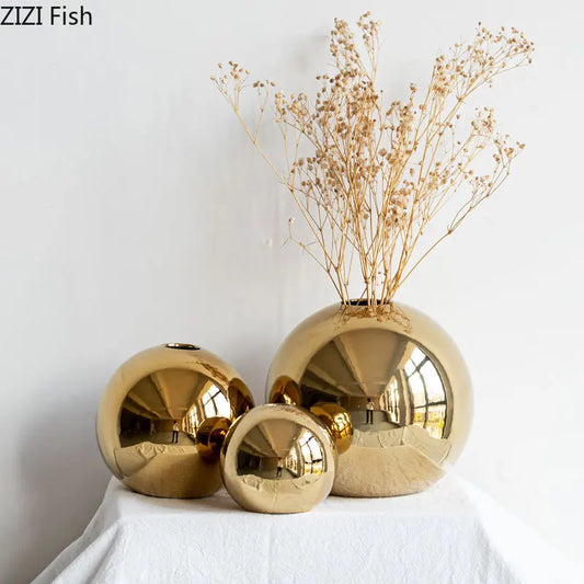 Elevate your home decor with the stunning Plating Golden Ball Ceramic Vase, perfect for showcasing artificial or dried flowers.