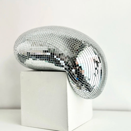 Transform your space with the Melting Disco Ball Home Decor, a stylish and versatile piece that adds glamour and charm to any setting.