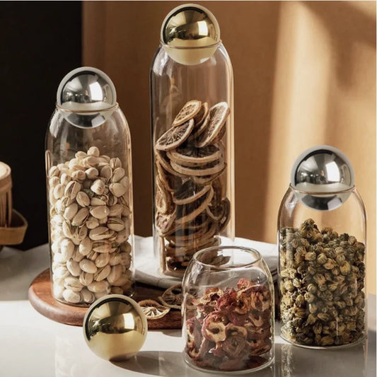 Store your kitchen essentials stylishly with our Golden Cork Glass Storage Jar, perfect for coffee beans, tea, and home decor.