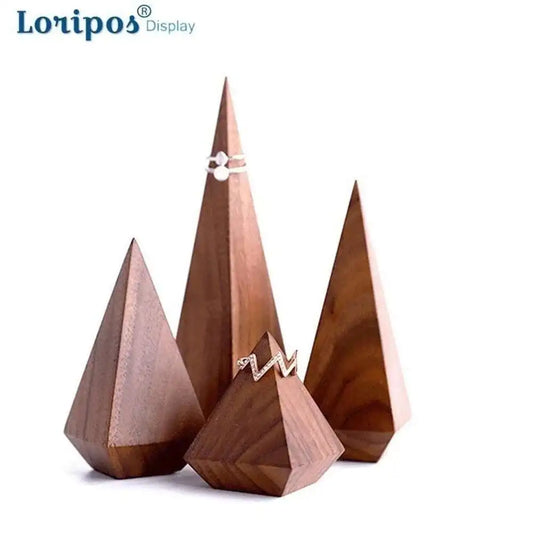 Wooden geometric ring stands with rings on a white background, branded 'Loripos'.