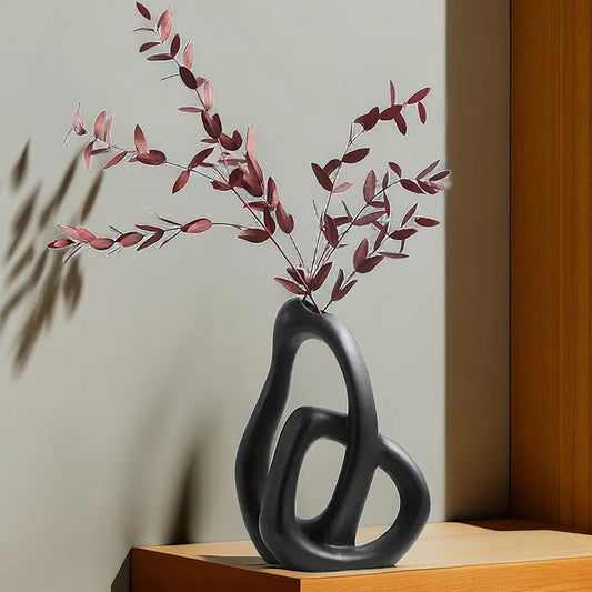 Elevate your decor with our Nordic Abstract Ceramic Vase, perfect for dried flowers or as a stunning accent piece in any room.
