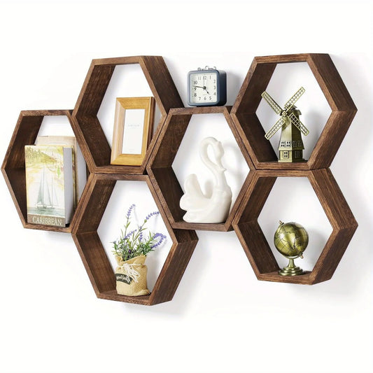 Hexagonal wooden shelves with decorative items on a white background