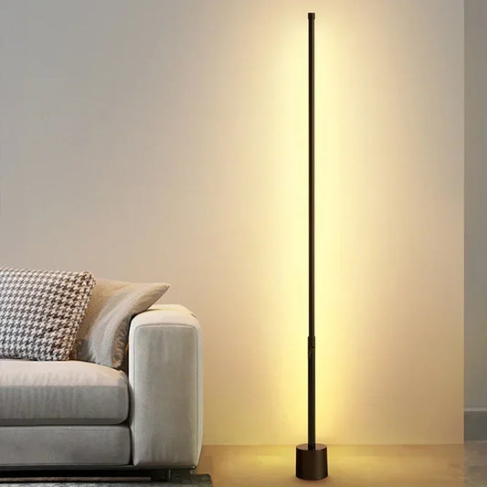 Illuminate your space with our Modern LED Floor Lamp, designed for stylish ambient lighting in any room, offering a sleek black finish and warm glow.