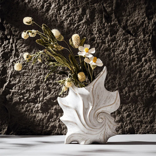 Elevate your space with our Ceramic Conch Vase, a stunning modern decor piece perfect for any tabletop, mantel, or bookshelf.