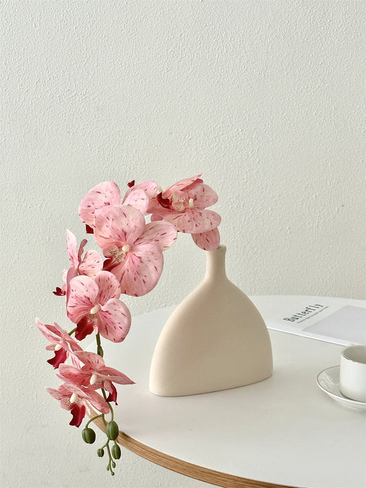 Enhance your home decor with high-end Phalaenopsis fake flowers, perfect for Mother's Day and any indoor setting.