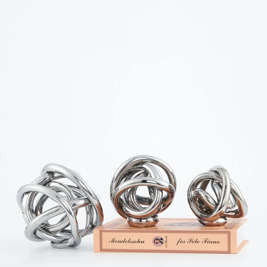 Enhance your home decor with this stunning Glass Abstract Sphere Figurine, featuring a modern design and elegant transparent finish.