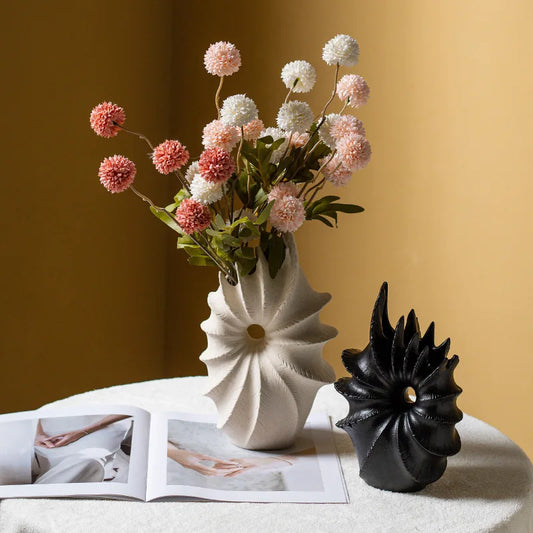 Elevate your home decor with our Ceramic Conch Vase, perfect for showcasing pampas grass and adding a modern touch to any tabletop.
