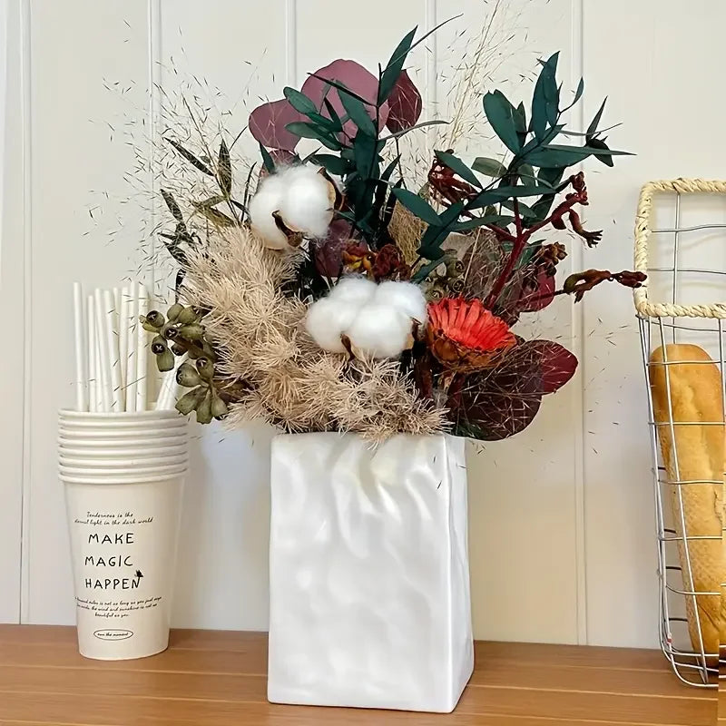 Discover the Creative Minimalist Pleated Paper Bag Unique Resin Vase, perfect for adding a Nordic Bohemian touch to your desktop home decoration.
