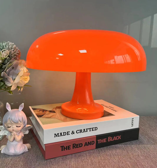 Illuminate your space with the Mushroom table lamp, a minimalist modern Danish designer orange bedside light perfect for a bohemian bedroom decor.
