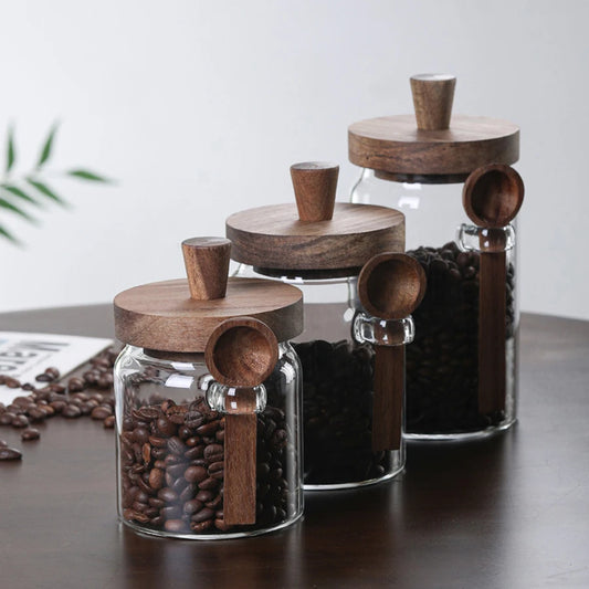 Airtight borosilicate glass storage containers with wooden lids, keep foods fresh, sealed, and dust-free, plus a handy scoop; shop now for tidy freshness!