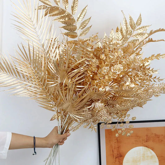 95cm gold artificial eucalyptus and ginkgo leaf stems for elegant home, wedding or event décor—durable plastic faux flowers for long-lasting shimmer.