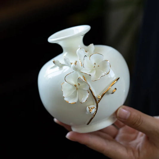 Porcelain Plumblossom Vase delivers timeless elegance with handmade white ceramic artistry, enriching homes or offices and making a perfect gift; Shop now.
