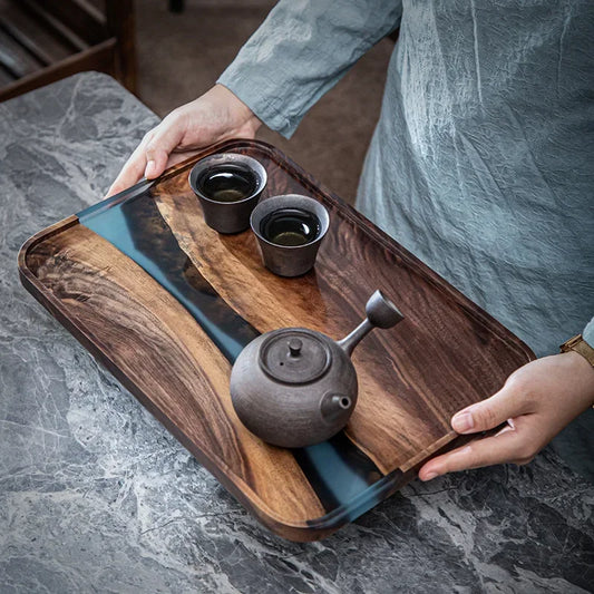 Black Walnut Tea Tray, handcrafted with resin accents, delivers a durable, sleek wooden tray for tea service and display—upgrade your table and shop today.