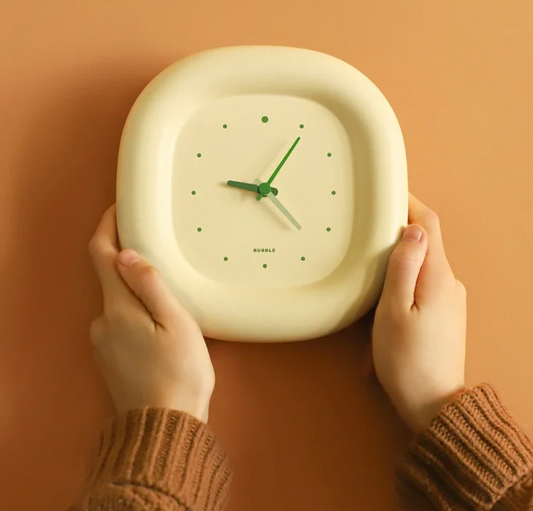 Enhance your space with the Cream Bubble Wall Clock, a stylish and silent addition to any living room or bedroom, combining creativity and functionality.
